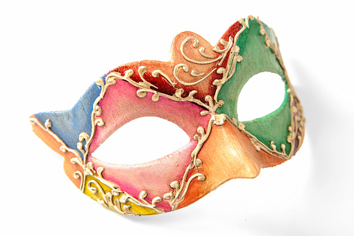 Golden Venetian carnival masks. Vintage masks on a beige background.