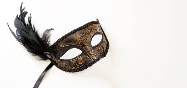 istock Carnival Venetian mask with black feather decoration isolated on white 1457833839