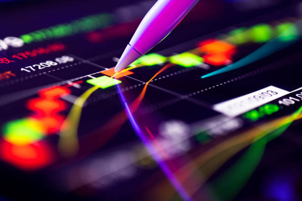 Person analyzing the market trends on a digital screen