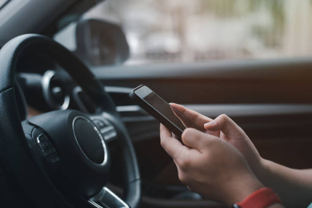 istock A young businessman is using his smartphone in his car. 1457841809