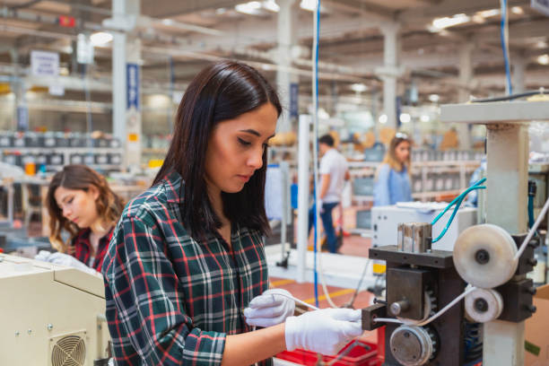 istock Group of workers working on the production line in factor 1457842452