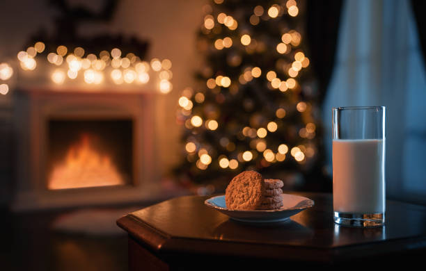 Glass of milk and cookies prepared for the Santa Claus stock photo