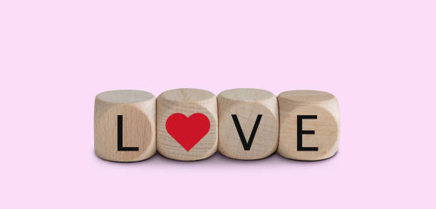 istock Love cubes isolated on pink background. Valentine's day concept. 1457844320