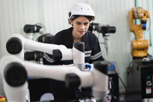 istock Engineer caucasian woman checking arm robot in the machine lap 1457846598