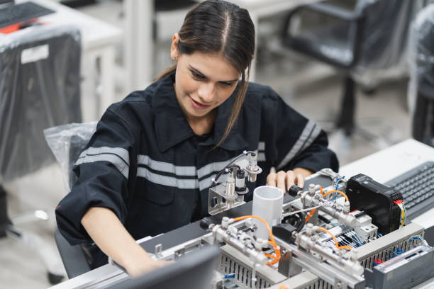 istock Engineer caucasian woman learning repair electric board in class 1457846628
