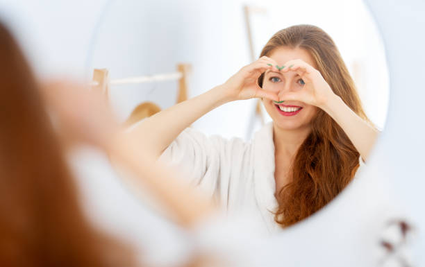 woman enjoying her reflection stock photo