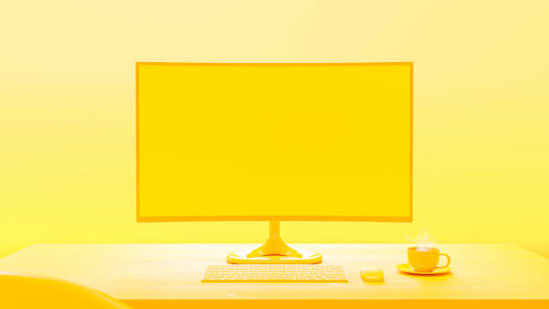 istock Computer Mock-Up yellow color on work desk and cup coffee in yellow room. 1457850322