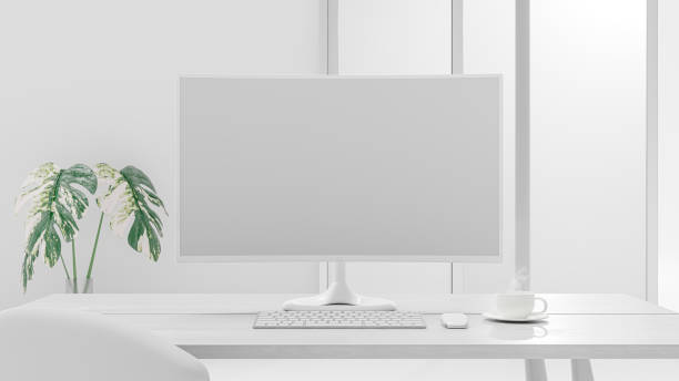istock Computer Mock-Up white color on work desk and cup coffee in office white room. 1457850336