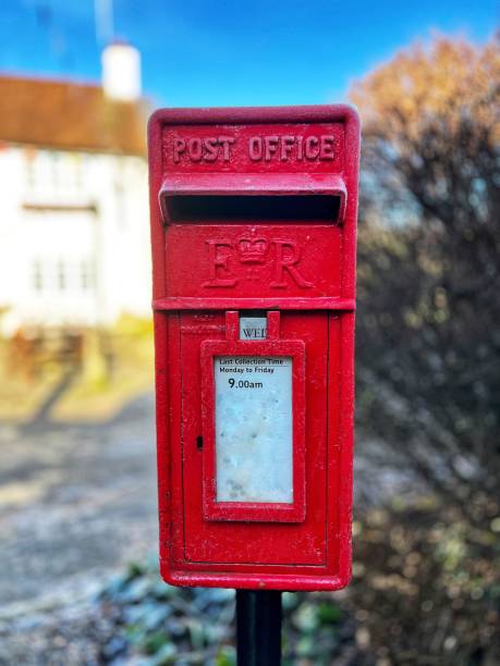 istock Traditional red mailbox in English village 1457859323