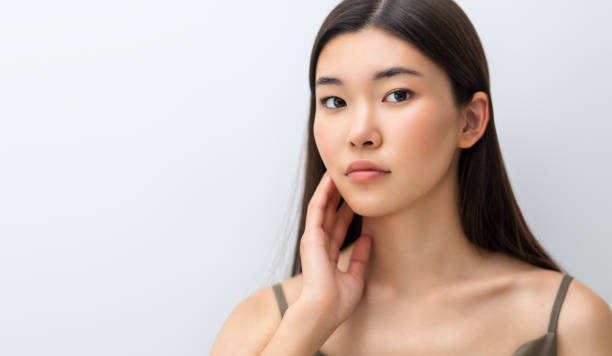 istock asian girl on grey background 1457860905