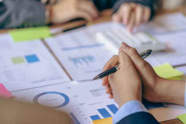 istock Intelligence analysis concept, group of business people brainstorm discussing current finance and economy on company investment laptop at meeting 1457862024