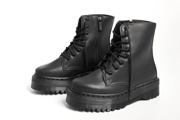 istock Black women combat boots on high heel platform with lug soles on isolated white background 1457863077