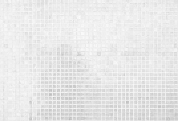 istock White tile wall chequered background bathroom texture. Ceramic brick wall and floor tiles mosaic background in bathroom and kitchen clean. Design pattern geometric with grid wallpaper decoration. 1457863835