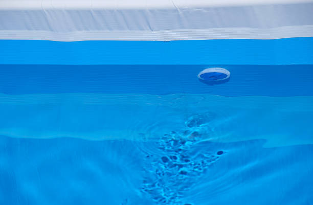 istock Water movement in the pool. Plastic nozzle. 1457874033
