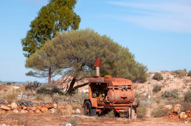 istock Old rusty equipment abandoned in field 1457875564