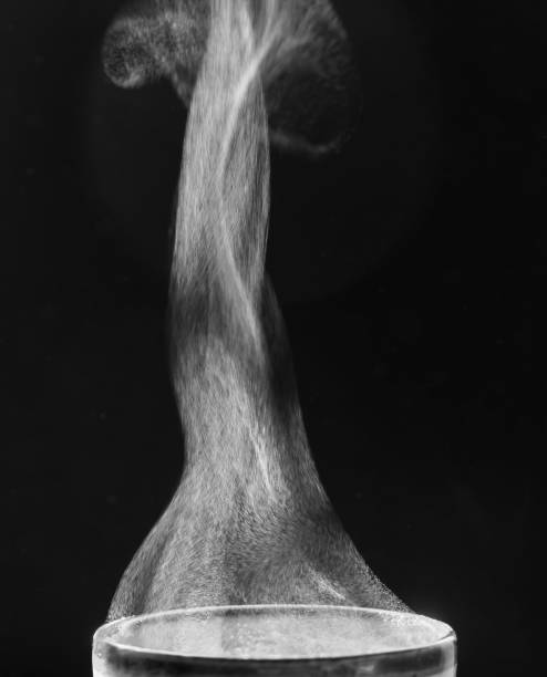 istock Liquid evaporation. Steam over the cup. Black and white. 1457875579