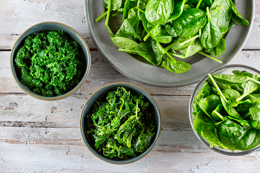 Sauteed spinach with garlic in a skillet, healthy side dish idea