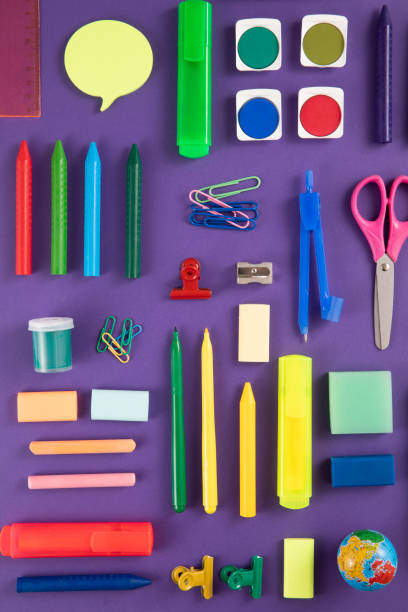 istock School Supplies on Purple Background 1457878196