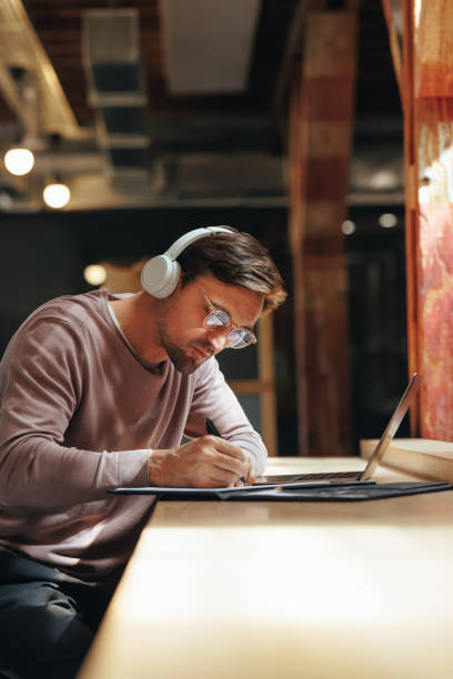 istock Male architect working on a project in a coworking space 1457878646