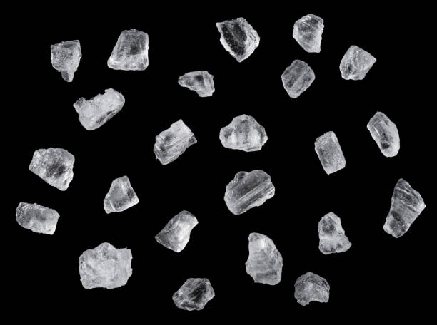 istock Salt crystals on black background. File contains clipping path. 1457883052
