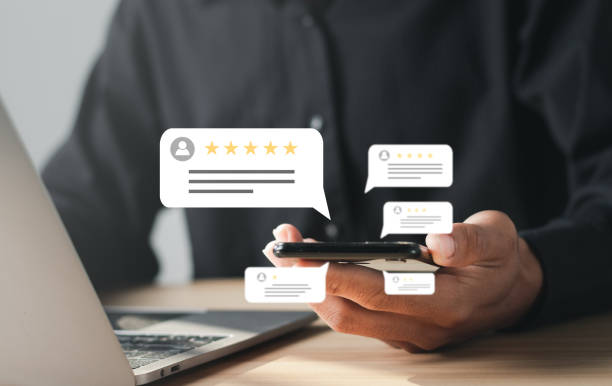 istock Businessman rates five-star customer service with a virtual screen on a laptop. Satisfaction Survey Concept Reviews Customer Quality Assessment. 1457888053