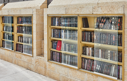 Jerusalem, Israel - November 15, 2022: Religious books for prayer in special storage near the wailing wall in Jerusalem.