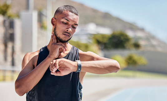 Fitness, runner or black man checking pulse on smartwatch for training time, wellness goal or workout on tracker app. Athlete, jogger or man for watch progress, heart rate or health cardio in street