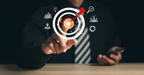 istock Businessman pointing to target icon on virtual screen. Startup business. Goal Setting Ideas, Objectives and Investment Goal Ideas 1457892986