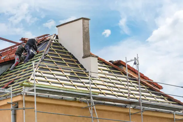 Photo of construction and roofing of house in process