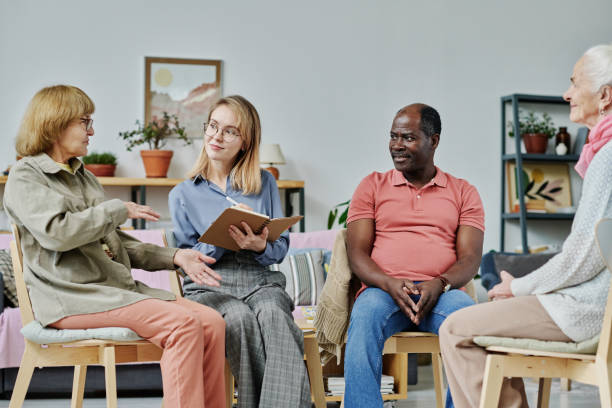 istock Senior people talking to psychologist 1457895808