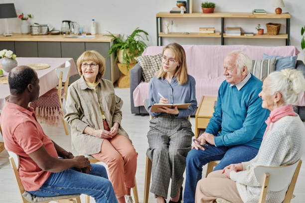 istock Senior people talking to psychotherapist at session 1457895872