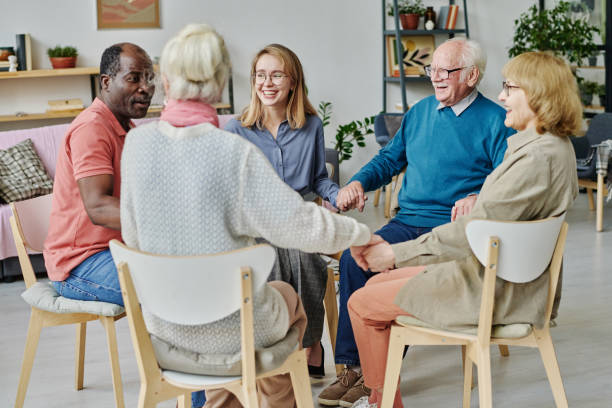 istock Happy senior people sitting at therapy 1457895937