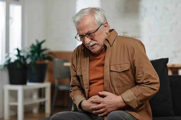 istock Senior man has stomachache 1457898388