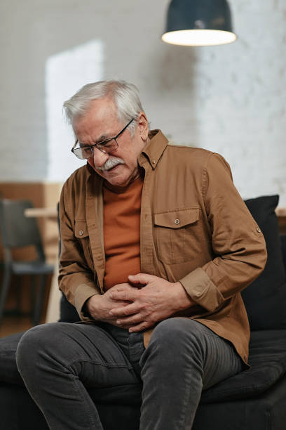 istock Senior man has stomachache 1457898394