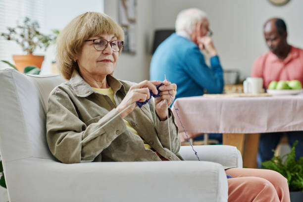istock Senior woman knitting during her leisure time 1457898617