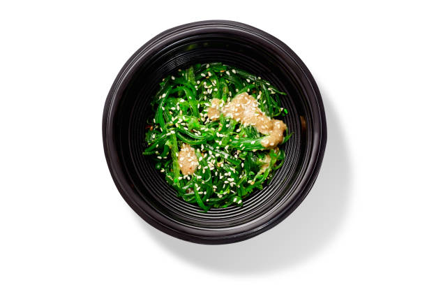 Japanese dish of spicy pickled hiyashi seaweeds with peanut sauce and sesame stock photo
