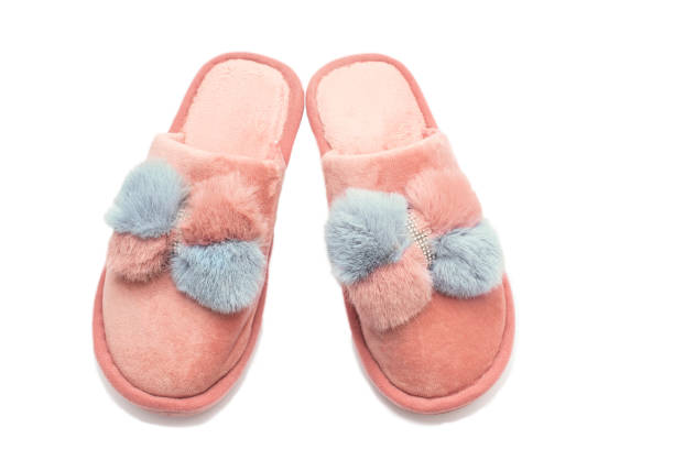 istock Home female peach and grey slippers on a white background. 1457899617