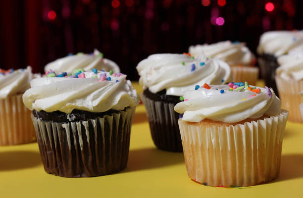 istock Cupcakes on Table at Party With Bokeh Background 1457899877