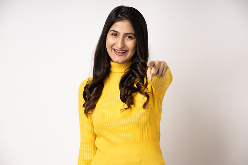 Portrait of young woman on white background