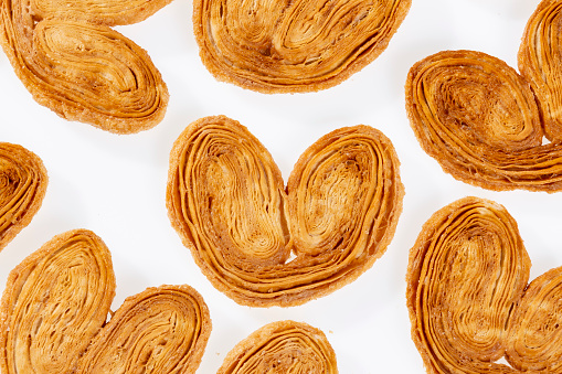 Bakery And Pastry - Tasty Puff Pastry Hearts Covered With Sugar; Photo White Background