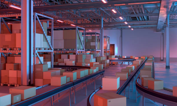 istock Warehouse full of shipping boxes on conveyor belts, night time 1457900749