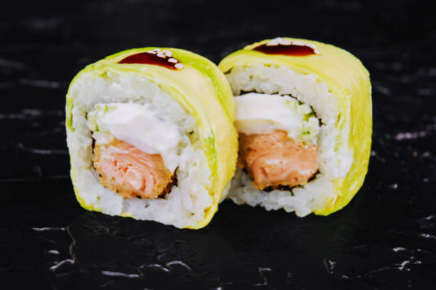 istock Rolls wrapped in avocado with fried salmon inside 1457902195