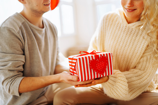 Exchange of gifts. Romantic day together. Valentines day, couple, relationships and people concept.