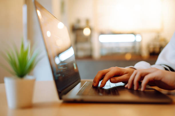 istock Female hands working on a laptop, close-up. Technology, Freelance, online course, remote work and lifestyle concept. 1457905177