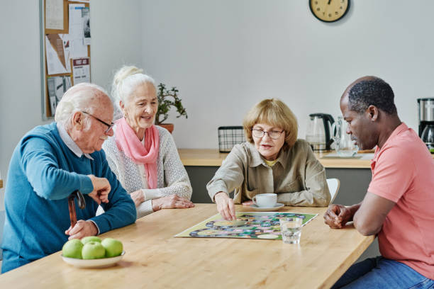 istock Senior people playing board games 1457905994