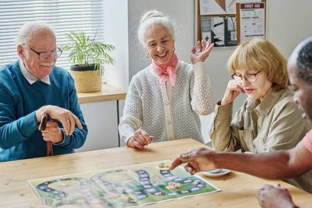 istock Senior people having fun playing board game 1457905998