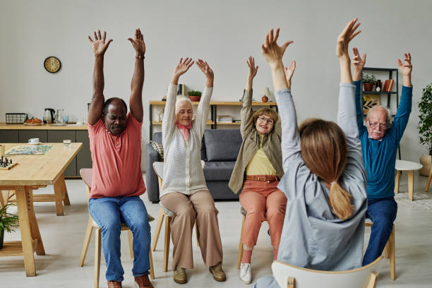 istock Senior people exercising together with instructor 1457906058