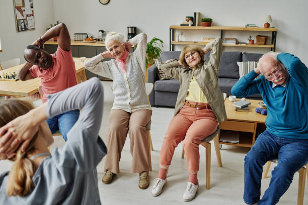 istock Senior people exercising in nursing home 1457906095