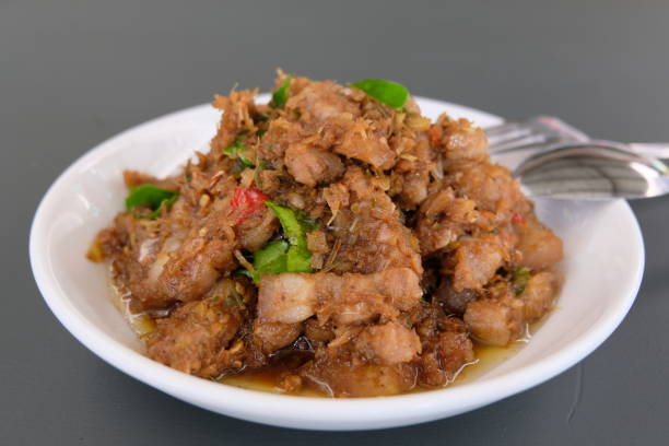 istock Stir-fried Pork with Shrimp Paste (Moo Pad Kapi) Thai Food spicy dish 1457908305