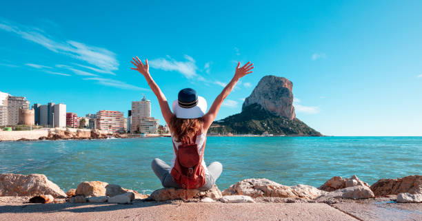 Happy woman tourist in Calpe,  Alicante province in Spain- Coasta blanca stock photo